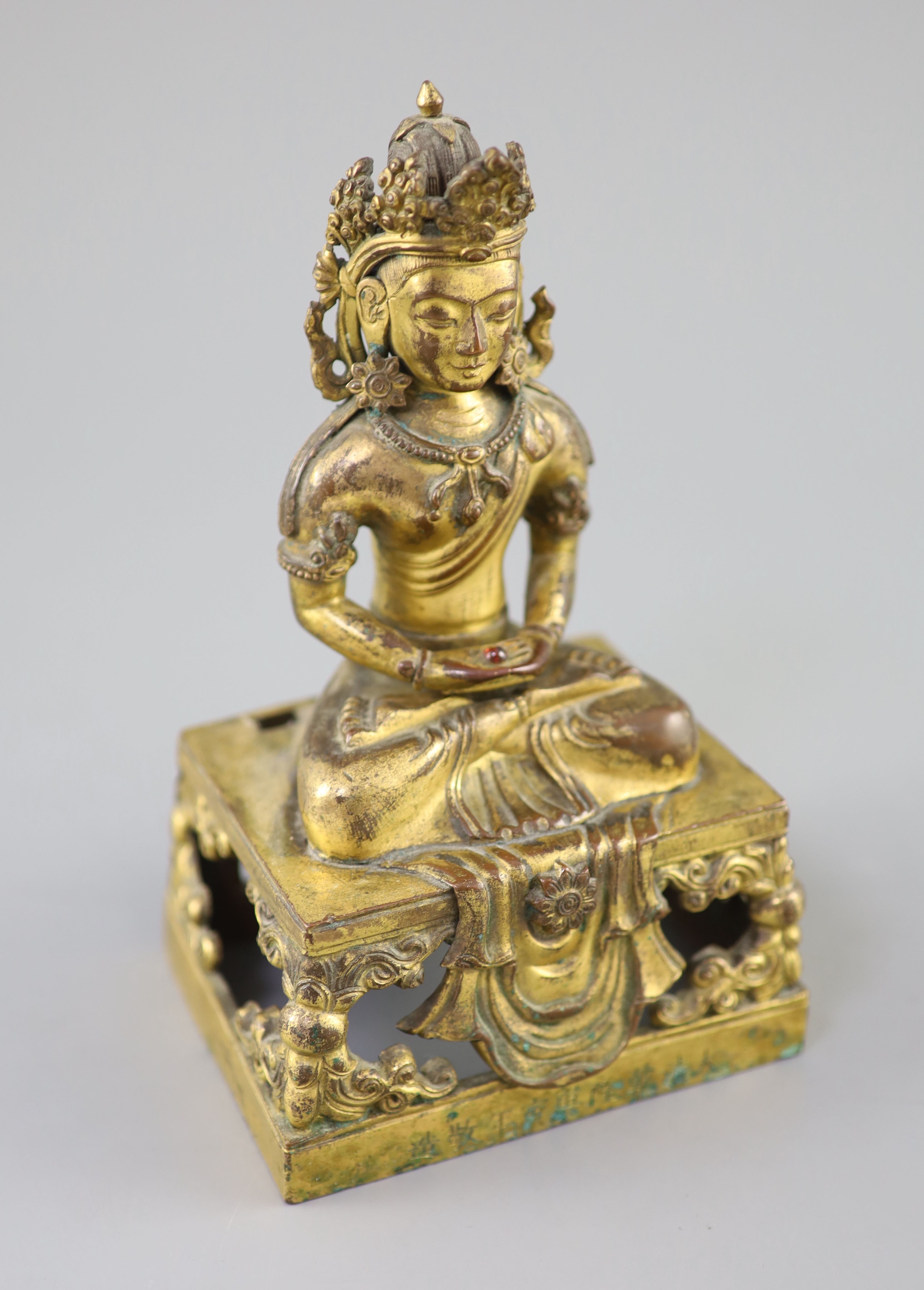 A Chinese gilt bronze seated figure of Amitayus, Qianlong period, dated 1770, Provenance - A. T. Arber-Cooke